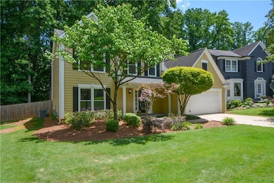 View of front of home featuring driveway and a garage