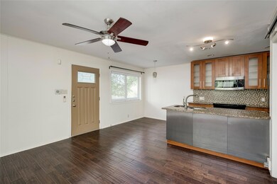 Kitchen featuring stainless steel microwave, brow