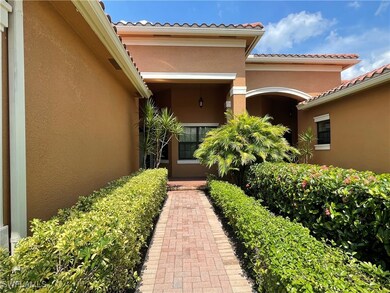 Entrance to property featuring stucco siding and a
