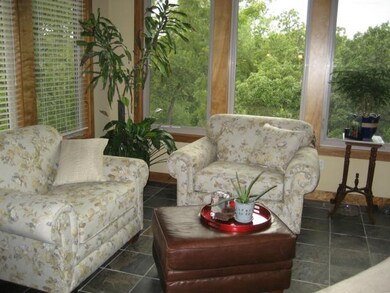 13 x 13 Sun Room w/door leading to covered trex de