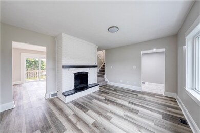 Living room has a large window, allowing lots of n