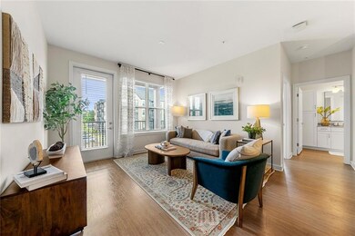 Living room with wood finished floors and baseboar
