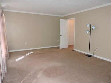 Main floor bedroom with 2 closets, one a large wal