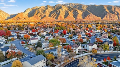 Aerial perspective of suburban area featuring a mountain backdrop