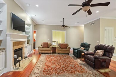 LIVING AREA COZY FIREPLACE AND BUILT IN SHELVING