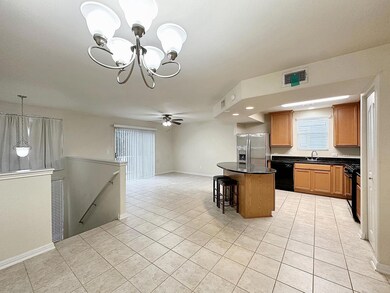 Kitchen featuring black appliances, dark countert