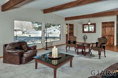 Large picture windows frame an upscale City neighb
