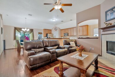 Living room with engineered hardwood floor, a tile