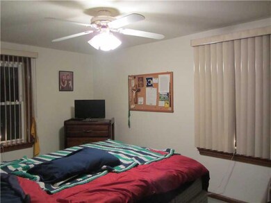 Bedroom. Largest of the 3 bedrooms, closet and woo
