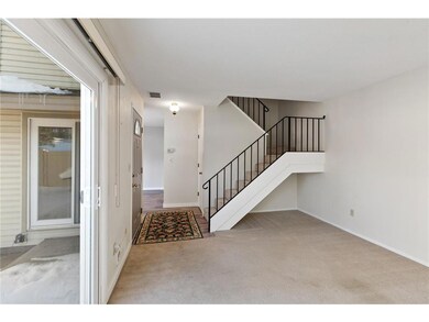 Open staircase leads to upper level.