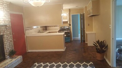 Looking at the kitchen, wood floors, spacious