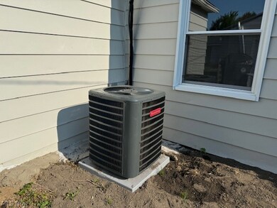 Details featuring wood walls and central AC unit