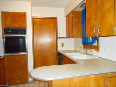 The kitchen offers an eating area