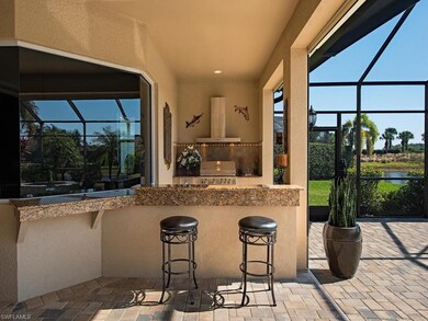 Custom outdoor kitchen with extended granite bar a