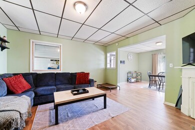 Living room with hardwood / wood-style flooring an