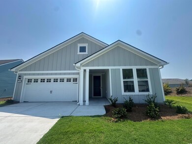 View of front of home featuring a garage and a fro