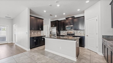 9881 Magnolia Woods Blvd, Orlando, FL 32832 - photo 7