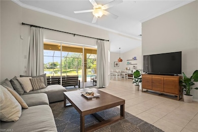 Living room with a ceiling fan, light tile pattern