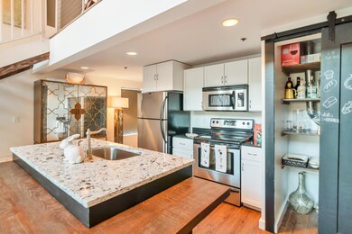 Kitchen offers a Pantry with Urban Barn Sliding Door... 