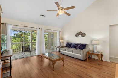 Living area featuring high vaulted ceiling, a ceil