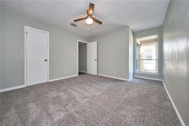 Unfurnished bedroom featuring carpet floors, a te
