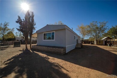 View of property exterior with a storage shed