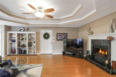 Large family room with hardwood / wood-style floor