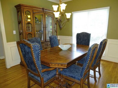 A very spacious Dining Room with hardwood flooring