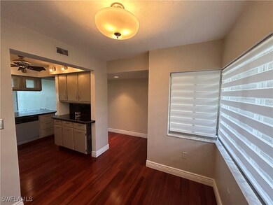 Kitchen with dishwashing machine, dark countertops