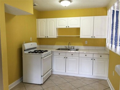 Freshly painted kitchen with newer range/oven, cab
