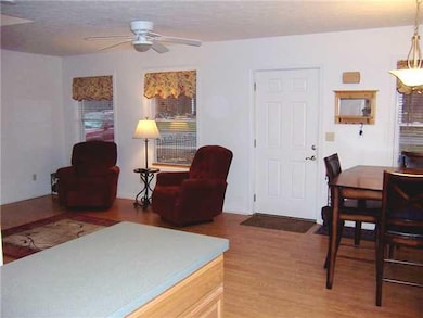 Kitchen. View of living room and dining area from 