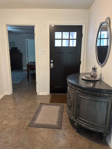 Entrance foyer featuring healthy amount of natural light
