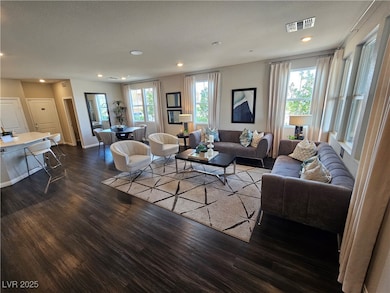 Living room featuring wood finished floors, recess
