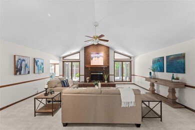 Great room has gas fireplace with brick surround, 