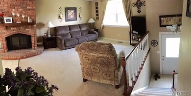 Living room, stairs leading to foyer , to right of