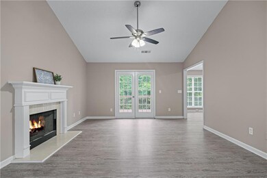 Living Room with Fireplace and Doors to Rear Deck