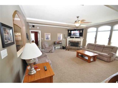 Lots of windows and fireplace invite you into this room