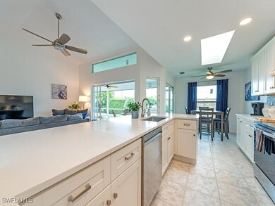 Kitchen with light tile patterned flooring, stainl