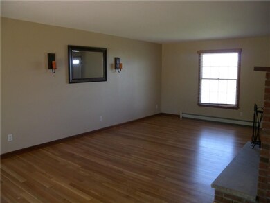 The recently refinished hardwood floors sparkle. J
