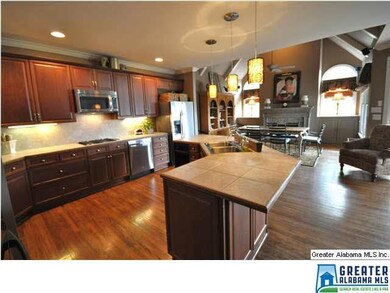 HUGE OPEN KITCHEN WITH CENTER WORK AREA AND BUILT-