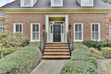 Covered front entrance on this all brick home