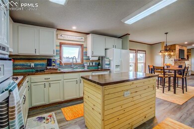 Kitchen has island and ample countertop space.