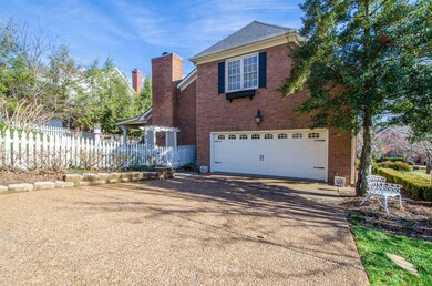 Side entry garage, backyard with an adorable white picket fence.  
