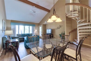 Open concept entertaining space with vaulted ceili