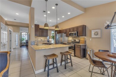 Kitchen featuring light tile patterned floors, sta