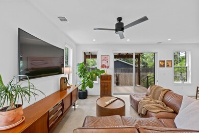 Living room with a wealth of natural light, a cei