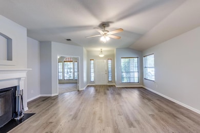 Unfurnished living room featuring wood finished f
