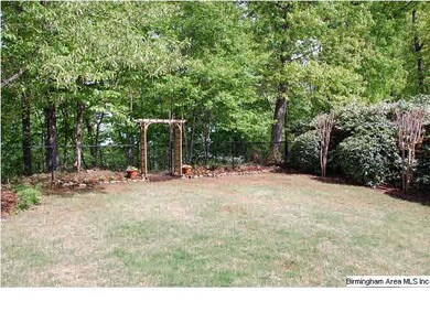 Lovely landscaped, fenced backyard.