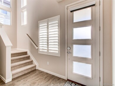 Gorgeous entry with natural light entering front d