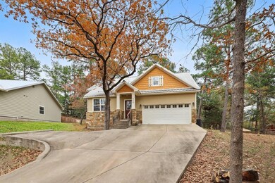 Craftsman-style home with concrete driveway, a me